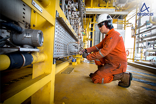 Technician recording calibration data on offshore site